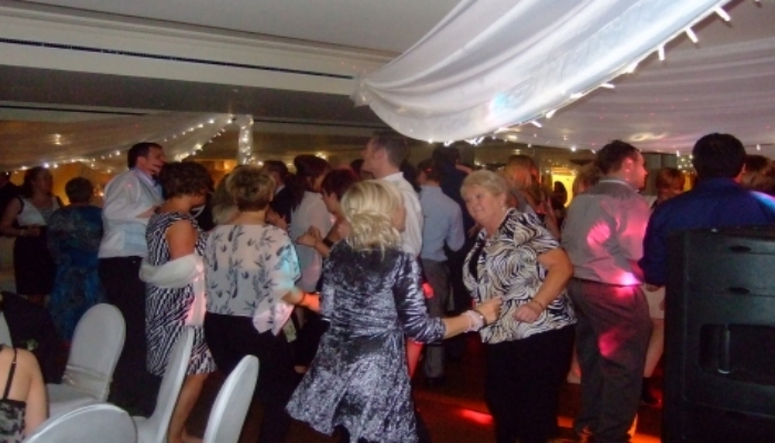 A full dance floor at a wedding reception